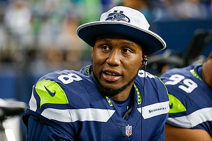 Aug 28, 2021; Seattle, Washington, USA; Seattle Seahawks defensive end Carlos Dunlap (8) sits on the bench during the second quarter against the Los Angeles Chargers at Lumen Field. Mandatory Credit: Joe Nicholson-USA TODAY Sports