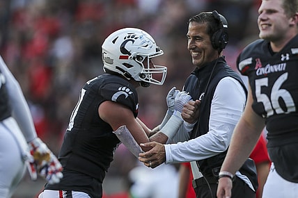 Sep 11, 2021; Cincinnati, Ohio, USA; Cincinnati Bearcats tight end Josh Whyle (81) celebrates after a touchdown with head coach Luke Fickell in the second half against the Murray State Racers at Nippert Stadium. Mandatory Credit: Katie Stratman-USA TODAY Sports
