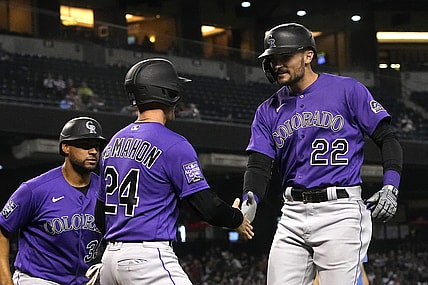 Oct 1, 2021; Phoenix, Arizona, USA; Colorado Rockies right fielder Sam Hilliard (22) celebrates with Ryan McMahon (24) after hitting a homerun against the Arizona Diamondbacks in the sixth inning at Chase Field. Mandatory Credit: Rick Scuteri-USA TODAY Sports