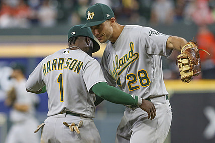 Oct 1, 2021; Houston, Texas, USA; Oakland Athletics third baseman Josh Harrison (1) hugs first baseman Matt Olson (28) after defeating the Houston Astros at Minute Maid Park. Mandatory Credit: Thomas Shea-USA TODAY Sports