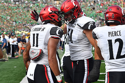 Oct 2, 2021; South Bend, Indiana, USA; Cincinnati Bearcats tight end Leonard Taylor (11) celebrates after a touchdown in the second quarter against the Notre Dame Fighting Irish at Notre Dame Stadium. Mandatory Credit: Matt Cashore-USA TODAY Sports