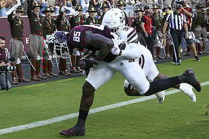 Oct 2, 2021; College Station, Texas, USA; Texas A&M Aggies tight end Jalen Wydermyer (85) catches a touchdown pass against Mississippi State Bulldogs safety Fred Peters (38)  in the first quarter at Kyle Field. Mandatory Credit: Thomas Shea-USA TODAY Sports