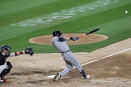 Oct 2, 2021; Chicago, Illinois, USA; Detroit Tigers left fielder Robbie Grossman (8) singles against the Chicago White Sox during the fourth inning at Guaranteed Rate Field. Mandatory Credit: Kamil Krzaczynski-USA TODAY Sports