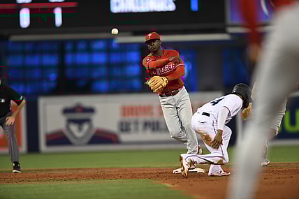 Oct 3, 2021; Miami, Florida, USA; Philadelphia Phillies shortstop Didi Gregorius (18) turns a double play against the Florida Marlins in the 2nd inning at loanDepot Park. Mandatory Credit: Jeremy Reper-USA TODAY Sports