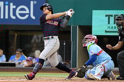 Oct 3, 2021; Arlington, Texas, USA; Cleveland Indians first baseman Yu Chang (2) follows though on his two-run home run against the Texas Rangers during the fifth inning at Globe Life Field. Mandatory Credit: Jim Cowsert-USA TODAY Sports