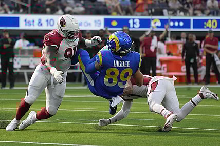 Oct 3, 2021; Inglewood, California, USA; Los Angeles Rams tight end Tyler Higbee (89) is tackled by Arizona Cardinals defensive end Michael Dogbe (91) and cornerback Byron Murphy (7) in the second half at SoFi Stadium. The Cardinals defeated the Rams 37-20. Mandatory Credit: Kirby Lee-USA TODAY Sports