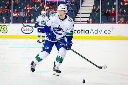 Oct 1, 2021; Calgary, Alberta, CAN; Vancouver Canucks defenseman Olli Juolevi (48) skates against the Calgary Flames during the third period at Scotiabank Saddledome. Mandatory Credit: Sergei Belski-USA TODAY Sports