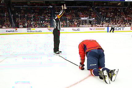 Oct 8, 2021; Washington, District of Columbia, USA; Washington Capitals left wing Alex Ovechkin (8) kneels on the ice after injuring his left knee against the Philadelphia Flyers during the first period at Capital One Arena. Mandatory Credit: Geoff Burke-USA TODAY Sports