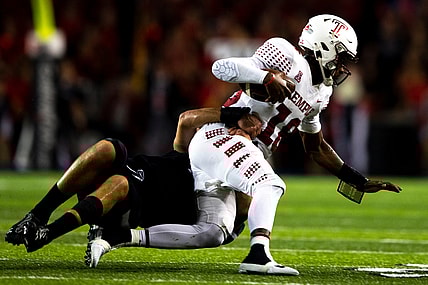 Cincinnati Bearcats linebacker Wilson Huber (2) sacks Temple Owls quarterback D'Wan Mathis (18) in the first half of the NCAA football game between the Cincinnati Bearcats and the Temple Owls on Friday, Oct. 8, 2021, at Nippert Stadium in Cincinnati.

Temple Owls At Cincinnati Bearcats