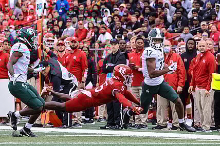 Oct 9, 2021; Piscataway, New Jersey, USA; Michigan State Spartans wide receiver Tre Mosley (17) is tackled by Rutgers Scarlet Knights defensive back Kessawn Abraham (5) during the first half at SHI Stadium. Mandatory Credit: Vincent Carchietta-USA TODAY Sports