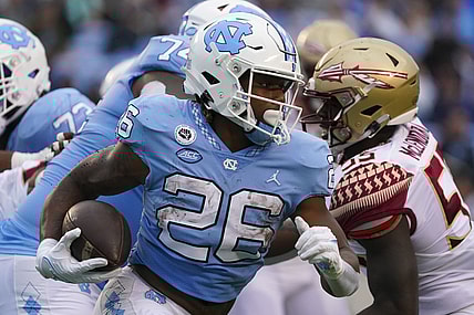Oct 9, 2021; Chapel Hill, North Carolina, USA; North Carolina Tar Heels running back D.J. Jones (26) runs with the ball during the first half against the Florida State Seminoles at Kenan Memorial Stadium. Mandatory Credit: James Guillory-USA TODAY Sports