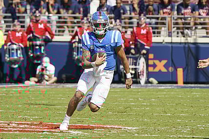 Oct 9, 2021; Oxford, Mississippi, USA; Mississippi Rebels quarterback Matt Corral (2) carries the ball against Arkansas Razorbacks at Vaught-Hemingway Stadium. Mandatory Credit: Marvin Gentry-USA TODAY Sports