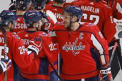 Oct 13, 2021; Washington, District of Columbia, USA; Washington Capitals left wing Alex Ovechkin (8) celebrates with Capitals center Hendrix Lapierre (29) after their game against the New York Rangers at Capital One Arena. Mandatory Credit: Geoff Burke-USA TODAY Sports