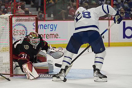 Oct 14, 2021; Ottawa, Ontario, CAN; Ottawa Senators goalie Anton Forsberg (31) makes a save on a shot from Toronto Maple Leafs left wing Micheal Bunting (58) in the first period at the Canadian Tire Centre. Mandatory Credit: Marc DesRosiers-USA TODAY Sports