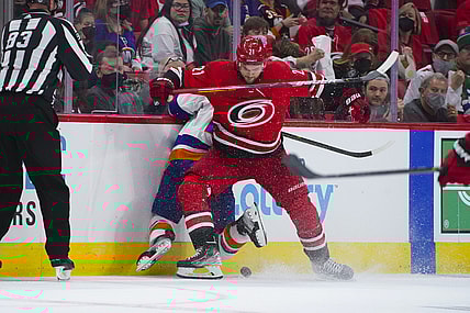 Oct 14, 2021; Raleigh, North Carolina, USA; Carolina Hurricanes right wing Nino Niederreiter (21) checks New York Islanders right wing Kyle Palmieri (21) during the first period at PNC Arena. Mandatory Credit: James Guillory-USA TODAY Sports