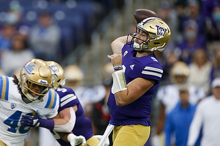 Oct 16, 2021; Seattle, Washington, USA; Washington Huskies quarterback Dylan Morris (9) passes against the UCLA Bruins during the first quarter at Alaska Airlines Field at Husky Stadium. Mandatory Credit: Joe Nicholson-USA TODAY Sports