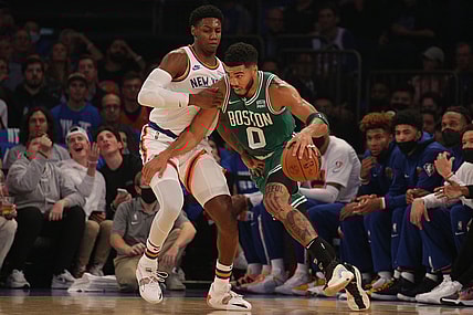 Oct 20, 2021; New York, New York, USA; Boston Celtics forward Jayson Tatum (0) controls the ball against New York Knicks guard RJ Barrett (9) during the first quarter at Madison Square Garden. Mandatory Credit: Brad Penner-USA TODAY Sports