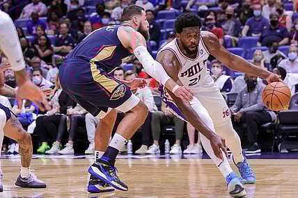 Oct 20, 2021; New Orleans, Louisiana, USA;  Philadelphia 76ers center Joel Embiid (21) dribbles around New Orleans Pelicans center Jonas Valanciunas (17) during the first half at Smoothie King Center. Mandatory Credit: Stephen Lew-USA TODAY Sports
