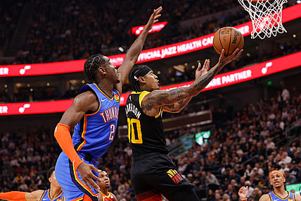 Oct 20, 2021; Salt Lake City, Utah, USA; Utah Jazz guard Jordan Clarkson (00) gets past Oklahoma City Thunder guard Shai Gilgeous-Alexander (2) and to the basket during the second quarter at Vivint Arena. Mandatory Credit: Chris Nicoll-USA TODAY Sports