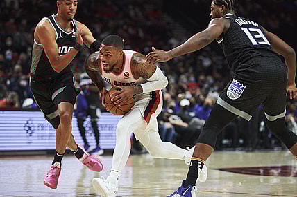 Oct 20, 2021; Portland, Oregon, USA; Portland Trail Blazers guard Damian Lillard (0) drives to the basket during the first half against Sacramento Kings guard Tyrese Haliburton (0) and center Tristan Thompson (13) at Moda Center. Mandatory Credit: Troy Wayrynen-USA TODAY Sports