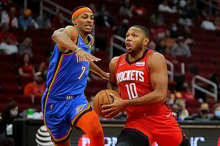 Oct 22, 2021; Houston, Texas, USA; Houston Rockets guard Eric Gordon (10, right) drives to the basket while Oklahoma City Thunder forward Darius Bazley (7, left) defends during the first quarter at Toyota Center. Mandatory Credit: Erik Williams-USA TODAY Sports