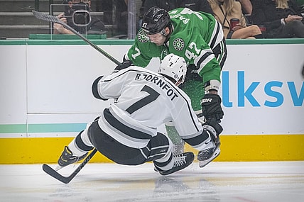 Oct 22, 2021; Dallas, Texas, USA; Dallas Stars right wing Alexander Radulov (47) and Los Angeles Kings defenseman Tobias Bjornfot (7) chase the puck during the second period at the American Airlines Center. Mandatory Credit: Jerome Miron-USA TODAY Sports