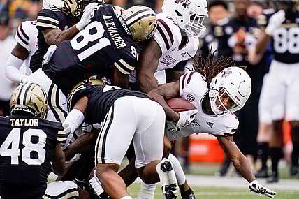 Mississippi State wide receiver Lideatrick Griffin (5) is brought down by Vanderbilt defenders during the first quarter at Vanderbilt Stadium in Nashville, Tenn., Saturday, Oct. 23, 2021.

Vandy Missst Fb 102321 An 010