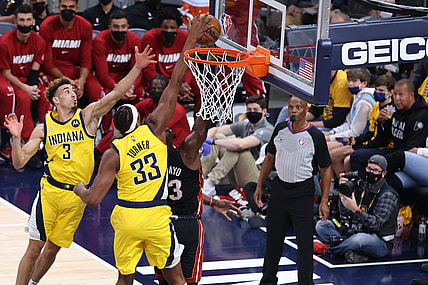 Oct 23, 2021; Indianapolis, Indiana, USA; Indiana Pacers center Myles Turner (33) blocks a shot by Miami Heat center Bam Adebayo (13) during the first half at Gainbridge Fieldhouse. Mandatory Credit: Robert Meyer-USA TODAY Sports