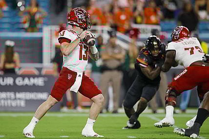 Oct 23, 2021; Miami Gardens, Florida, USA; North Carolina State Wolfpack quarterback Devin Leary (13) prepares to throws a pass against the Miami Hurricanes during the first quarter of the game at Hard Rock Stadium. Mandatory Credit: Sam Navarro-USA TODAY Sports