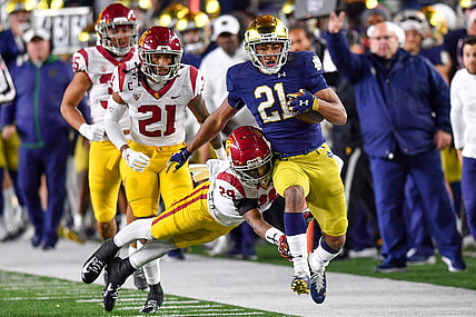 Oct 23, 2021; South Bend, Indiana, USA; Notre Dame Fighting Irish wide receiver Lorenzo Styles Jr. (21) runs the ball as USC Trojans safety Xavion Alford (29) attempts to tackle in the second quarter at Notre Dame Stadium. Mandatory Credit: Matt Cashore-USA TODAY Sports