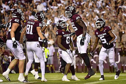 Oct 23, 2021; College Station, Texas, USA;  Texas A&M Aggies tight end Jalen Wydermyer (85) celebrates his touchdown with Texas A&M Aggies wide receiver Jalen Preston (5), Texas A&M Aggies wide receiver Ainias Smith (0), during the first quarter against the South Carolina Gamecocks at Kyle Field. Mandatory Credit: Maria Lysaker-USA TODAY Sports
