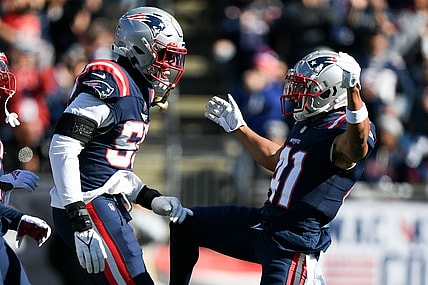 Oct 24, 2021; Foxborough, Massachusetts, USA;  New England Patriots cornerback Myles Bryant (41) reacts with linebacker Josh Uche (55) after sacking New York Jets quarterback Zach Wilson (not seen) during the first half at Gillette Stadium. Mandatory Credit: Brian Fluharty-USA TODAY Sports