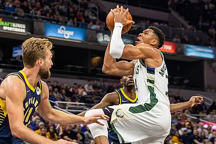 Oct 25, 2021; Indianapolis, Indiana, USA; Milwaukee Bucks forward Giannis Antetokounmpo (34) shoots the ball while Indiana Pacers forward Domantas Sabonis (11) defends in the first quarter at Gainbridge Fieldhouse. Mandatory Credit: Trevor Ruszkowski-USA TODAY Sports