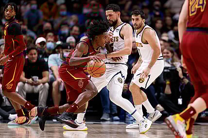 Oct 25, 2021; Denver, Colorado, USA; Cleveland Cavaliers guard Collin Sexton (2) dribbles the ball as Denver Nuggets guard Austin Rivers (25) defends in the second quarter at Ball Arena. Mandatory Credit: Isaiah J. Downing-USA TODAY Sports