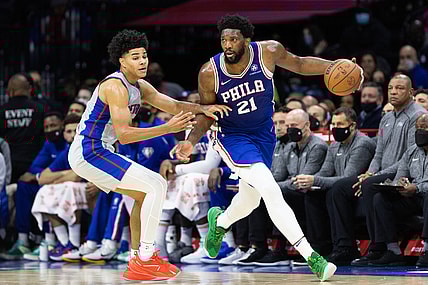 Oct 28, 2021; Philadelphia, Pennsylvania, USA; Philadelphia 76ers center Joel Embiid (21) dribbles past Detroit Pistons guard Killian Hayes (7) during the second quarter at Wells Fargo Center. Mandatory Credit: Bill Streicher-USA TODAY Sports