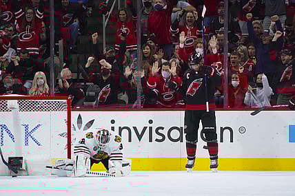 Oct 29, 2021; Raleigh, North Carolina, USA;  Carolina Hurricanes center Jordan Staal (11) celebrates his first period goal past Chicago Blackhawks goaltender Kevin Lankinen (32) at PNC Arena. Mandatory Credit: James Guillory-USA TODAY Sports