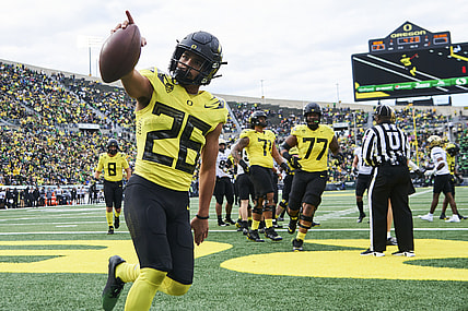 Oct 30, 2021; Eugene, Oregon, USA; Oregon Ducks running back Travis Dye (26) celebrates after scoring a touchdown during the first half against the Colorado Buffaloes at Autzen Stadium. Mandatory Credit: Troy Wayrynen-USA TODAY Sports