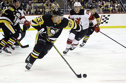 Oct 30, 2021; Pittsburgh, Pennsylvania, USA;  Pittsburgh Penguins left wing Brock McGinn (23) skates with the puck against the New Jersey Devils during the first period at PPG Paints Arena. Mandatory Credit: Charles LeClaire-USA TODAY Sports