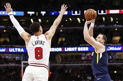 Oct 30, 2021; Chicago, Illinois, USA; Utah Jazz guard Joe Ingles (2) shoots against Chicago Bulls guard Zach LaVine (8) during the first half at United Center. Mandatory Credit: Kamil Krzaczynski-USA TODAY Sports