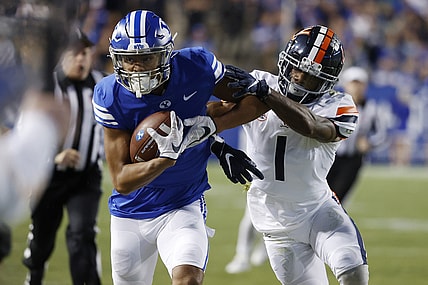 Oct 30, 2021; Provo, Utah, USA; Brigham Young Cougars wide receiver Keanu Hill (1) is pushed out of bounds after a reception by Virginia Cavaliers cornerback Nick Grant (1) in the first quarter  at LaVell Edwards Stadium. Mandatory Credit: Jeffrey Swinger-USA TODAY Sports
