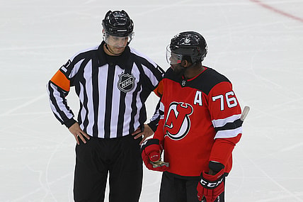 Apr 9, 2021; Newark, New Jersey, USA; referee Frederick L'Ecuyer (17) and New Jersey Devils defenseman P.K. Subban (76) talk during the first period at Prudential Center. Mandatory Credit: Ed Mulholland-USA TODAY Sports