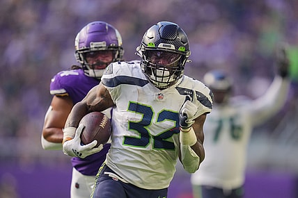 Sep 26, 2021; Minneapolis, Minnesota, USA; Seattle Seahawks running back Chris Carson (32) scores a touchdown against the Minnesota Vikings in the second quarter at U.S. Bank Stadium. Mandatory Credit: Brad Rempel-USA TODAY Sports