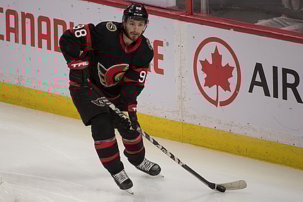 Oct 4, 2021; Ottawa, Ontario, CAN; Ottawa Senators defenseman Victor Mete (98) skates with the puck in the third period against the Toronto Maple Leafs  at the Canadian Tire Centre. Mandatory Credit: Marc DesRosiers-USA TODAY Sports