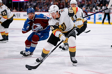 Oct 26, 2021; Denver, Colorado, USA; Vegas Golden Knights center Jonathan Marchessault (81) controls the puck ahead of Colorado Avalanche left wing J.T. Compher (37) in the second period at Ball Arena. Mandatory Credit: Isaiah J. Downing-USA TODAY Sports