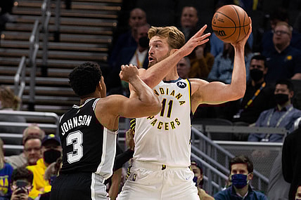 Nov 1, 2021; Indianapolis, Indiana, USA; Indiana Pacers forward Domantas Sabonis (11) controls the ball while San Antonio Spurs forward Keldon Johnson (3) defends  in the first quarter at Gainbridge Fieldhouse. Mandatory Credit: Trevor Ruszkowski-USA TODAY Sports