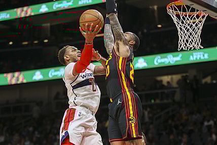 Nov 1, 2021; Atlanta, Georgia, USA; Washington Wizards center Daniel Gafford (21) shoots past Atlanta Hawks forward John Collins (20) in the first quarter at State Farm Arena. Mandatory Credit: Brett Davis-USA TODAY Sports