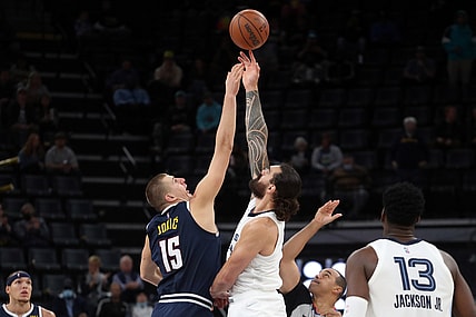Nov 1, 2021; Memphis, Tennessee, USA; Denver Nuggets center Nikola Jokic (15) and Memphis Grizzles center Steven Adams (4) jump ball to start the game at FedExForum. Mandatory Credit: Petre Thomas-USA TODAY Sports