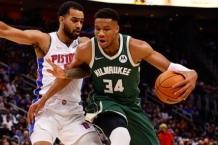 Nov 2, 2021; Detroit, Michigan, USA; Milwaukee Bucks forward Giannis Antetokounmpo (34) is defended by Detroit Pistons forward Trey Lyles (8) in the first half at Little Caesars Arena. Mandatory Credit: Rick Osentoski-USA TODAY Sports