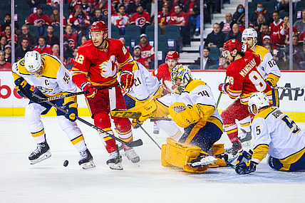 Nov 2, 2021; Calgary, Alberta, CAN; Nashville Predators goaltender Juuse Saros (74) makes a save against the Calgary Flames during the first period at Scotiabank Saddledome. Mandatory Credit: Sergei Belski-USA TODAY Sports