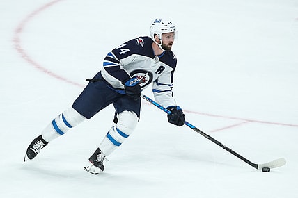 Oct 19, 2021; Saint Paul, Minnesota, USA; Winnipeg Jets defenseman Josh Morrissey (44) skates with the puck against the Minnesota Wild in the third period at Xcel Energy Center. Mandatory Credit: David Berding-USA TODAY Sports